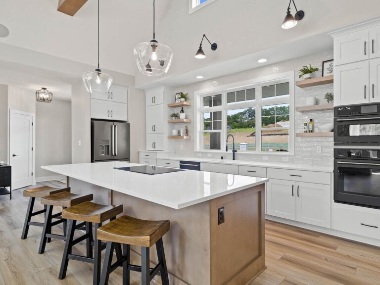 The Kenzie at Redford Hills, modern kitchen with island and stools
