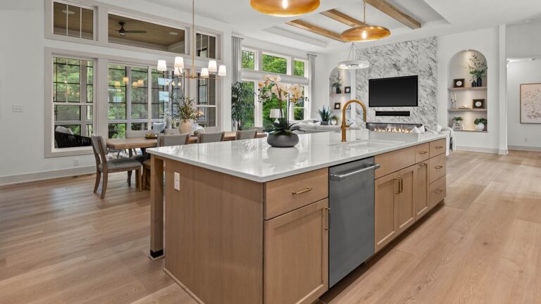 The Nora at Bella Vista Estates, modern kitchen with dining area overlooking to the great room
