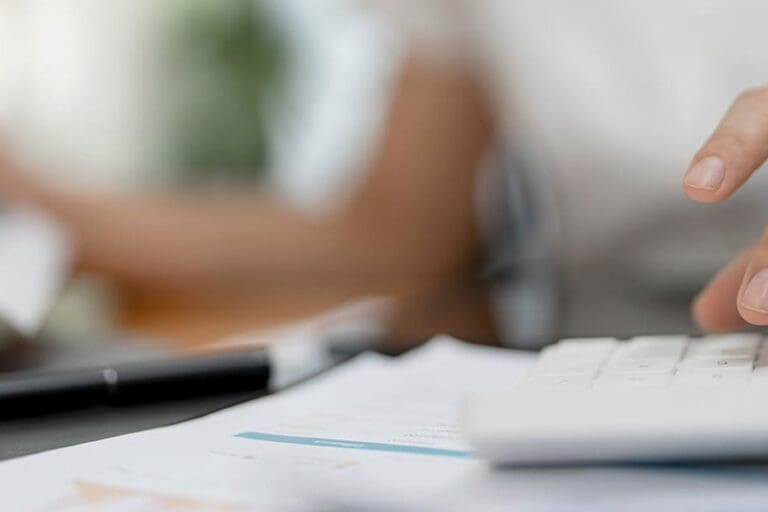 Female accountant or banker making calculations on the housing market