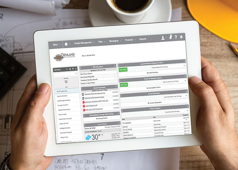 Trade Partners cloud-based project management software on a tablet