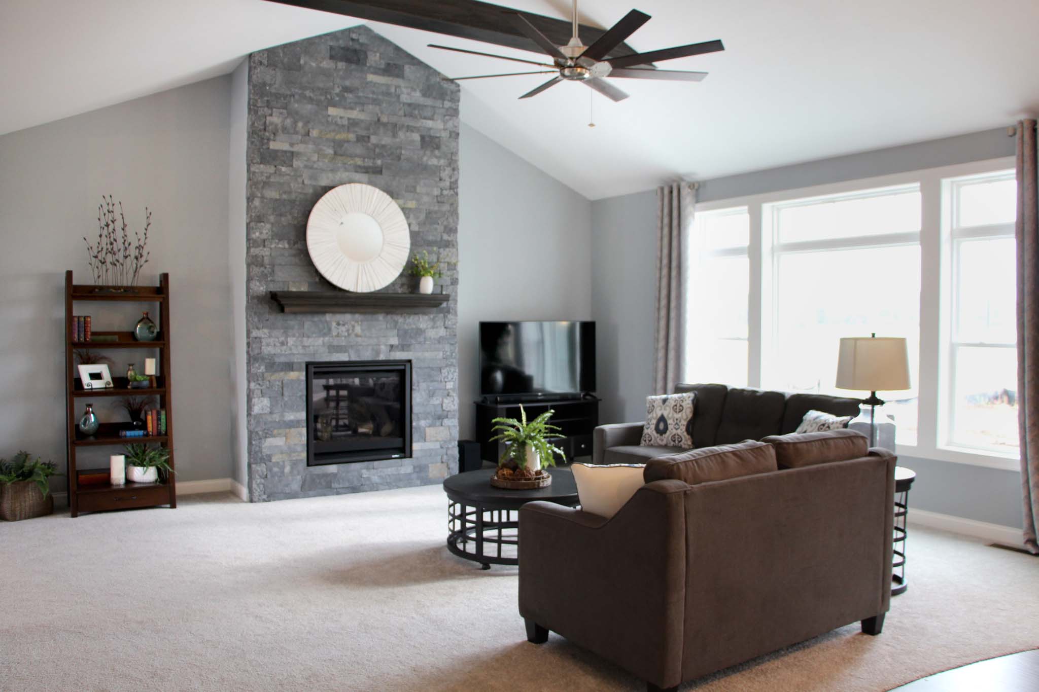 Living room with full-height fireplace in the Brooklyn model home