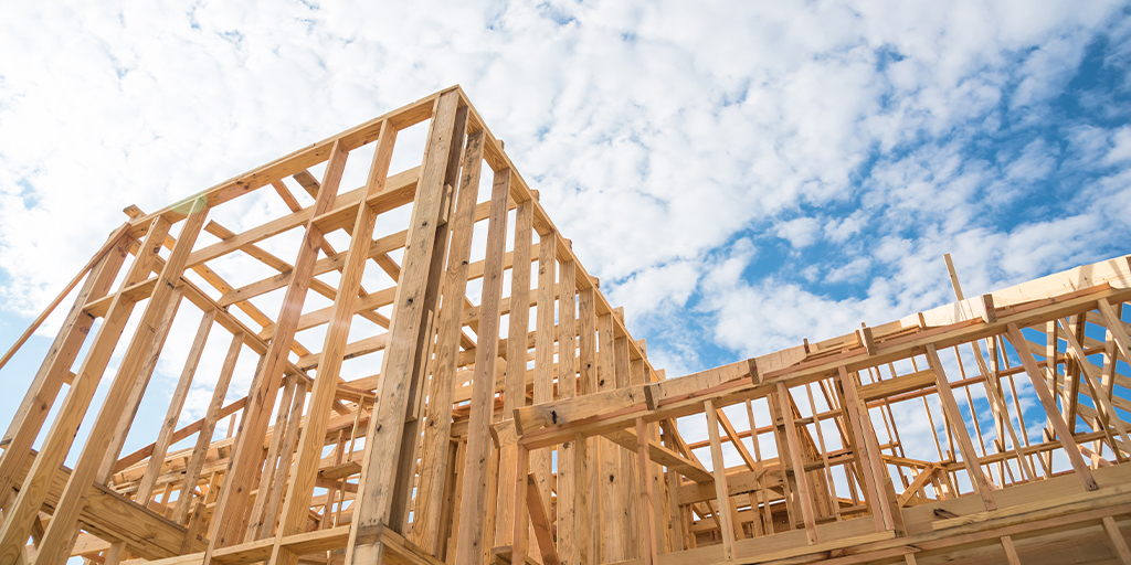 Framing structure/wood frame of wooden houses/home. House construction and real estate concept background.