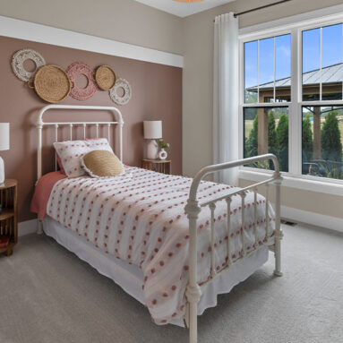 Parade of Homes model, The Lexi, second bedroom that outlooks the backyard.